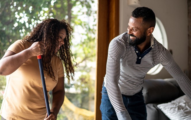 Mature Couple Cleaning House Together