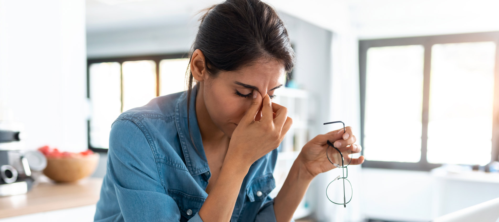 Stressed Business Woman Working From Home On Laptop Looking Worried