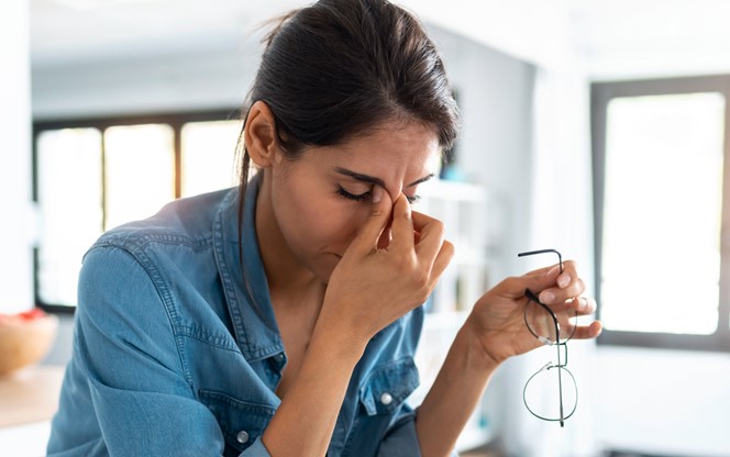 Stressed Business Woman Working From Home On Laptop Looking Worried