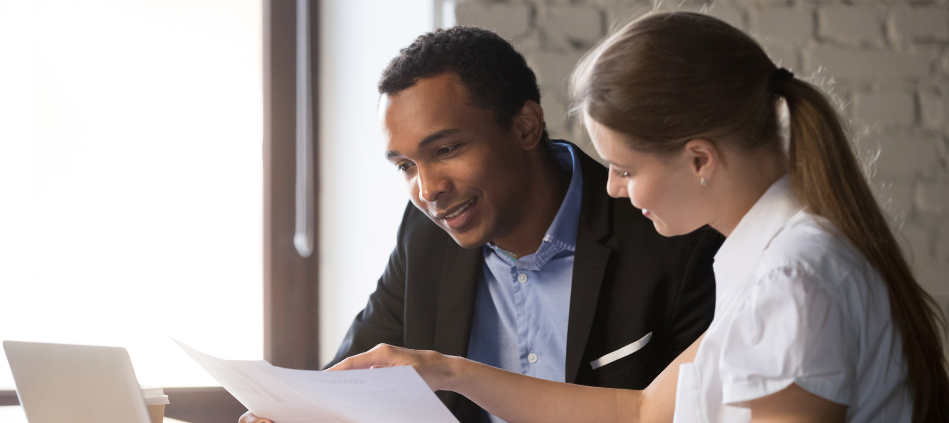 Female Financial Advisor Insurer Consulting Male African American Client