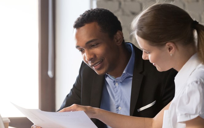 Female Financial Advisor Insurer Consulting Male African American Client