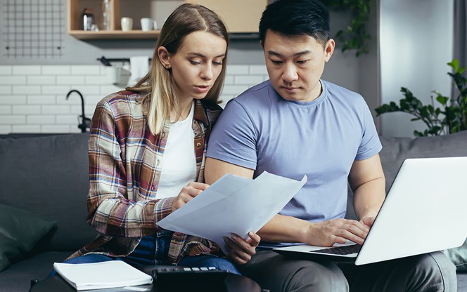 Young Couple Reviewing Documents