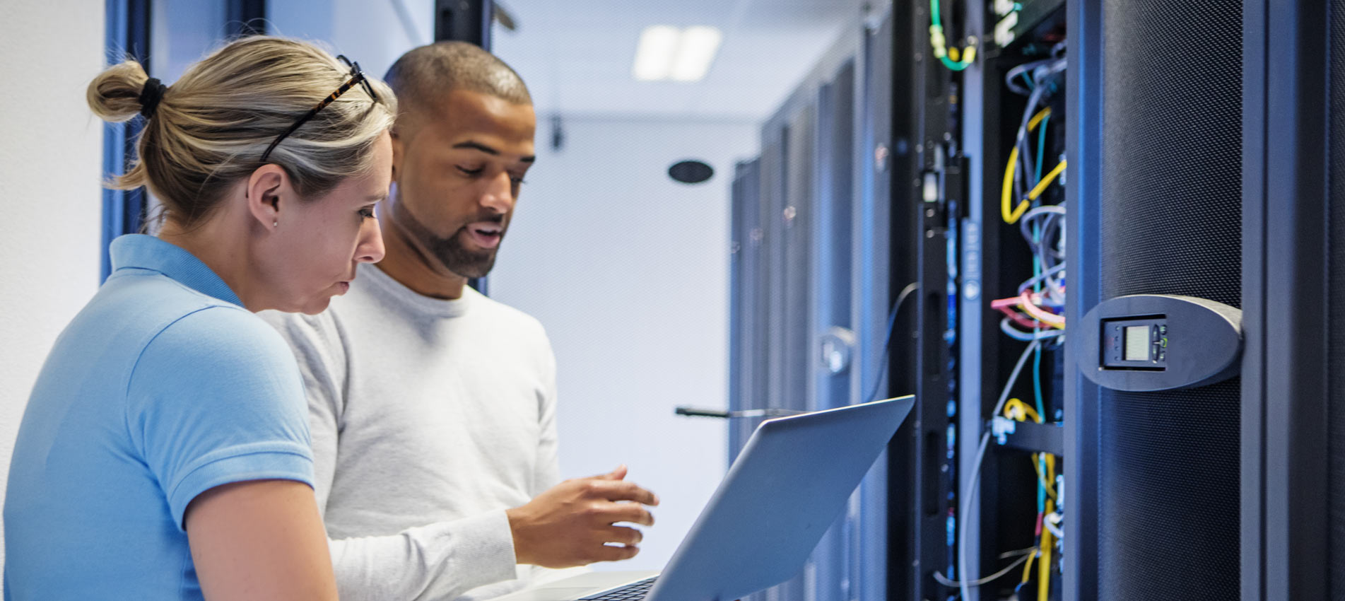 A Duo Of Server Room Technicians Back At The Server Room
