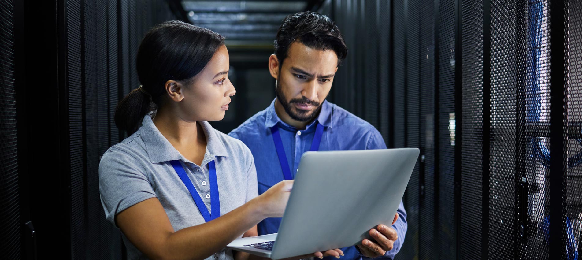 Two data center engineers assessing risk