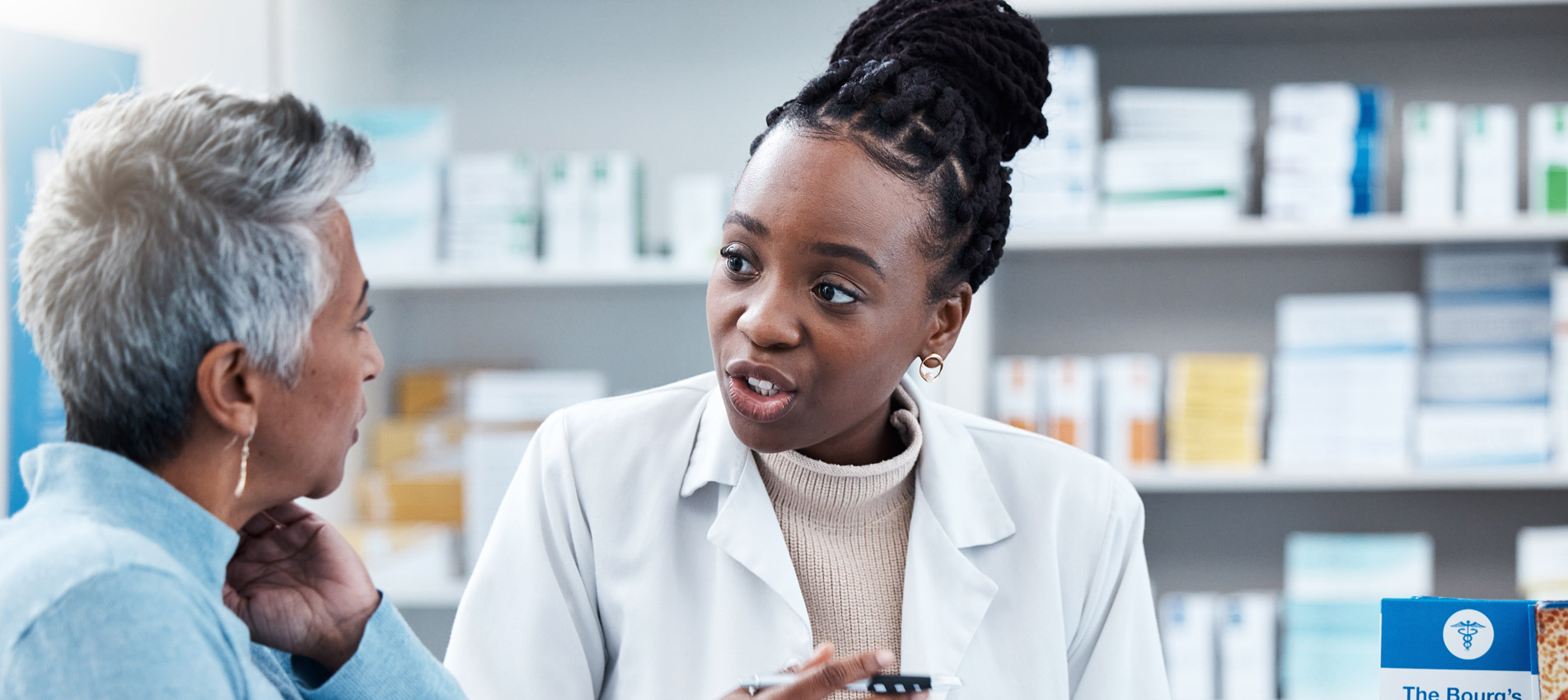 Female Medicine Professional Helping A Patient In A Drugstore