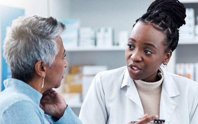 Female Medicine Professional Helping A Patient In A Drugstore