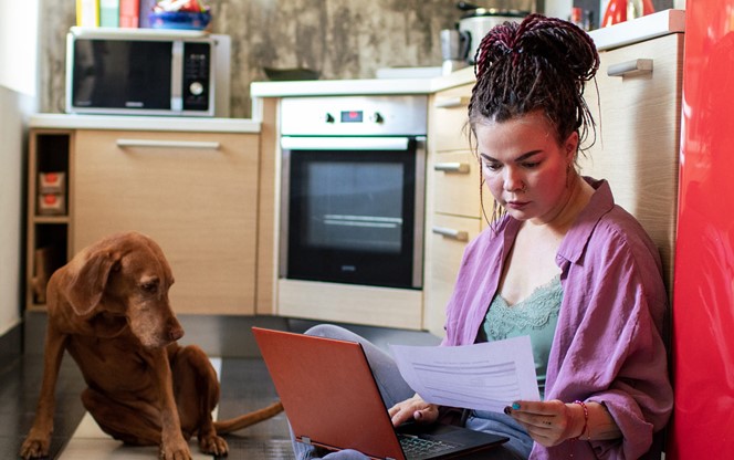 IRS Addresses Matches for Qualified Student Loan Payments Young Adult Woman Going Over Her Finances