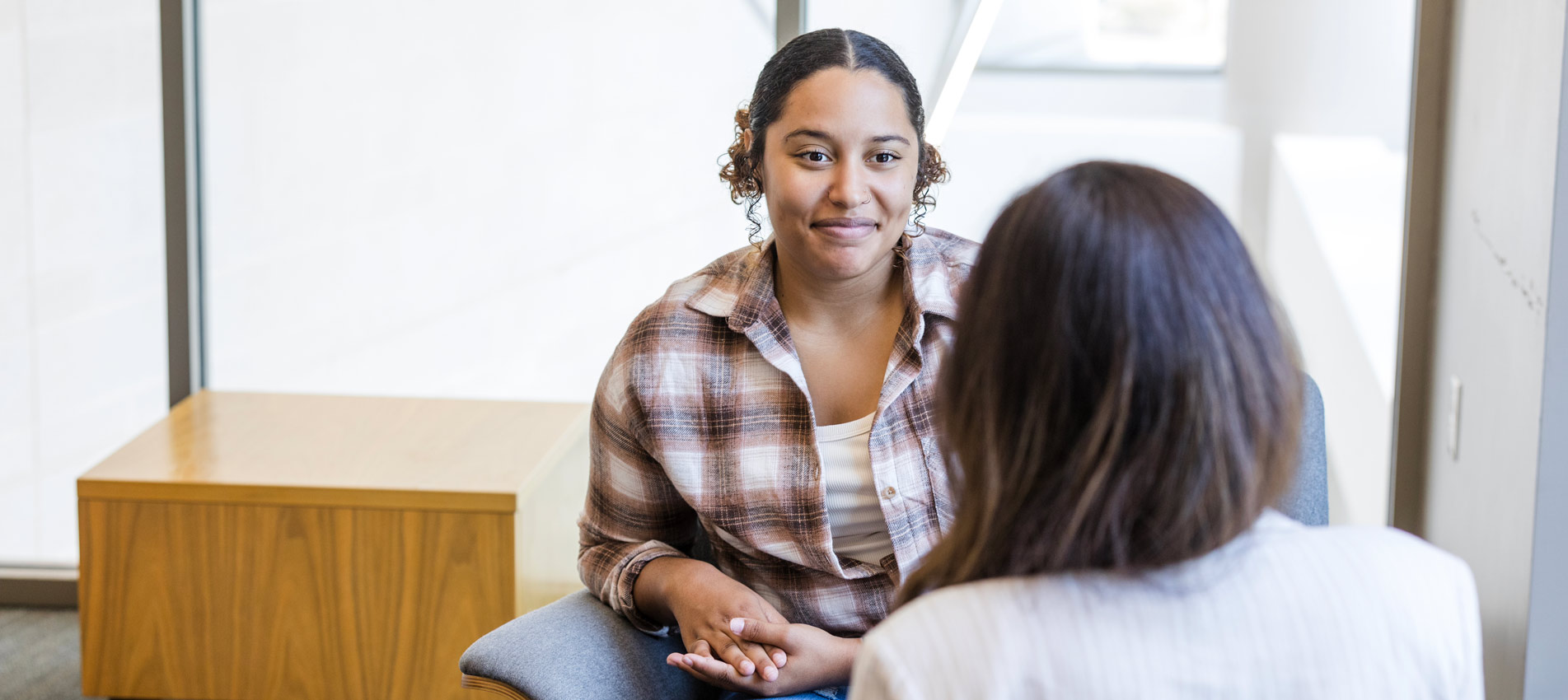 Young Latin Female Meeting With Her Therapist