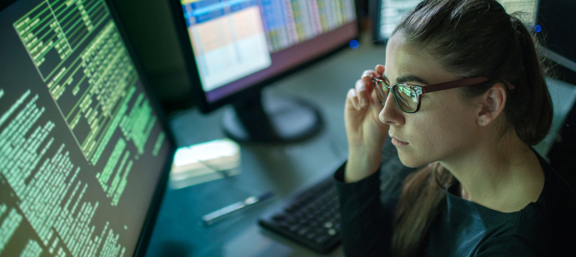 Young Woman Looking At Data On Screen