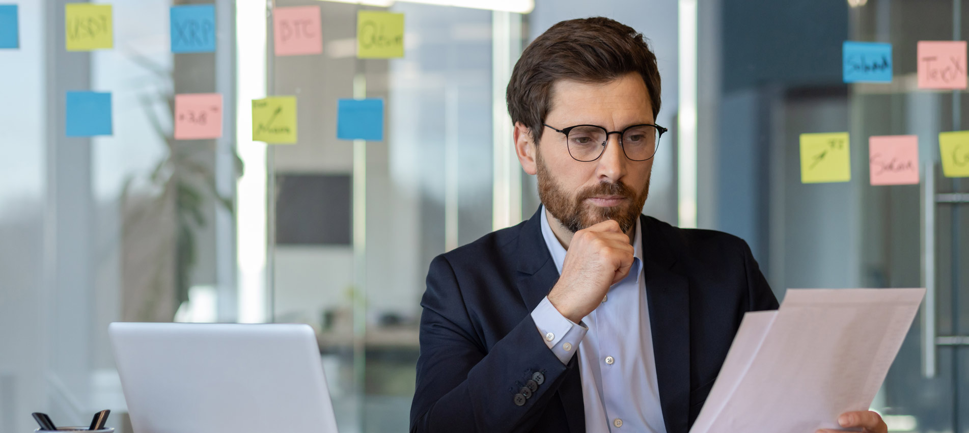 Businessman Analyzing Financial Documents At The Office
