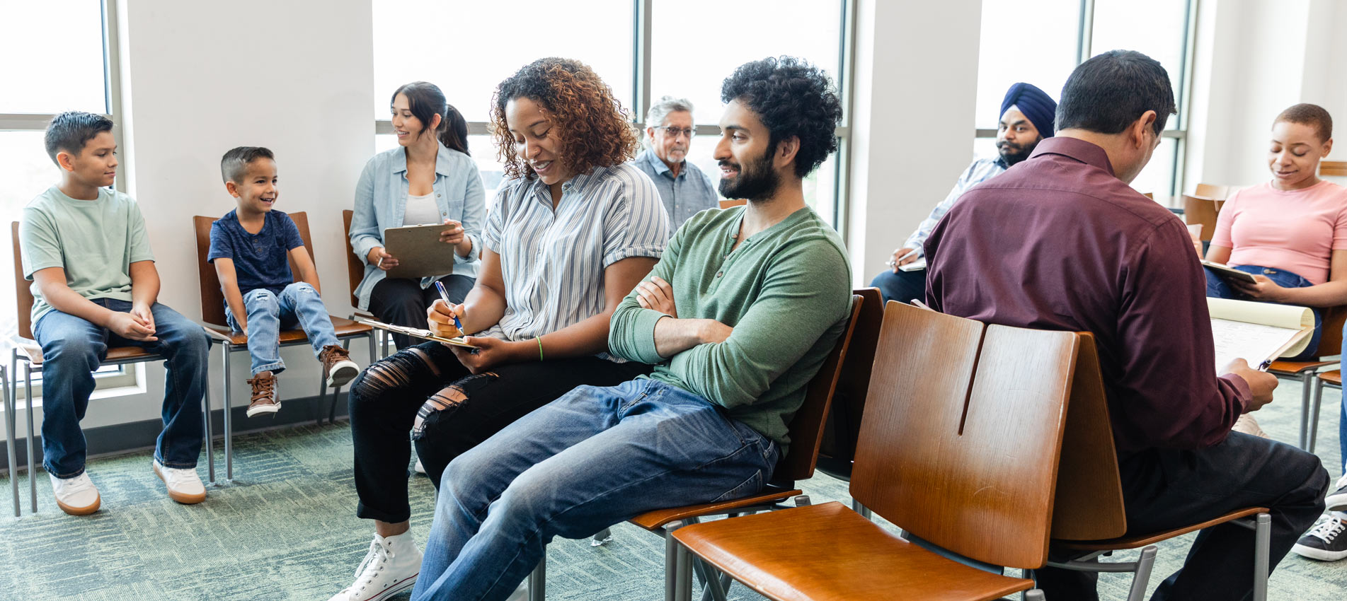 Large Group Of Diverse People Wait To See Doctor