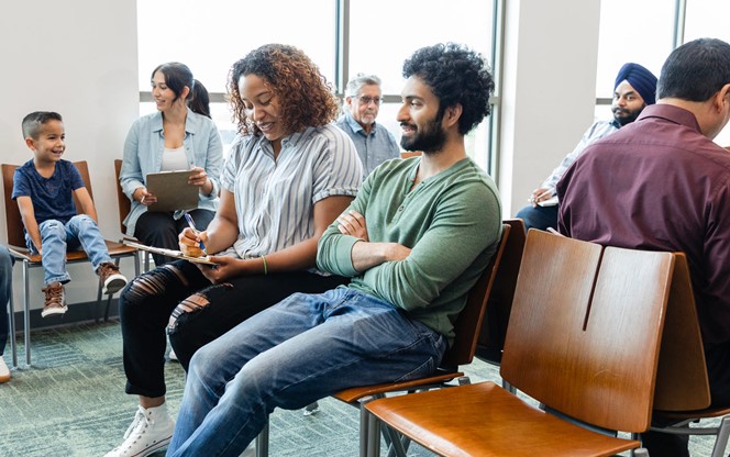 Large Group Of Diverse People Wait To See Doctor