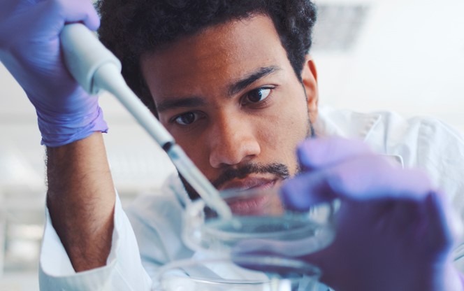 Young Scientist Working In Laboratory