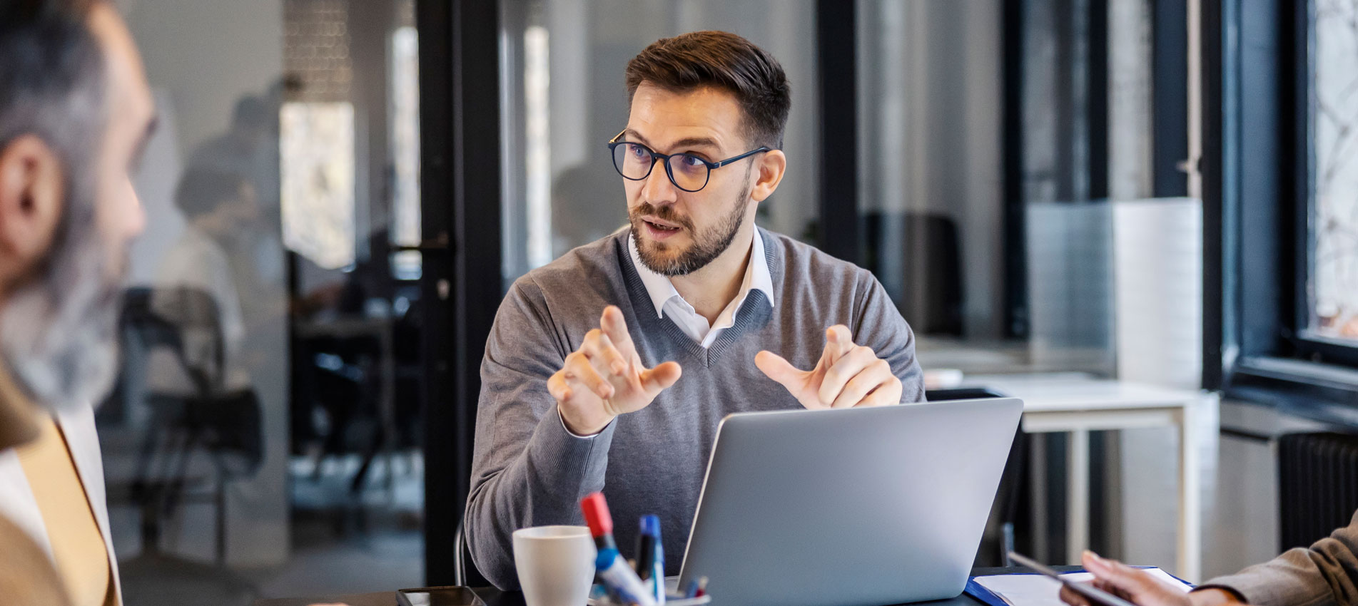 Businessman Discussing Technology Trends With A Group Of People