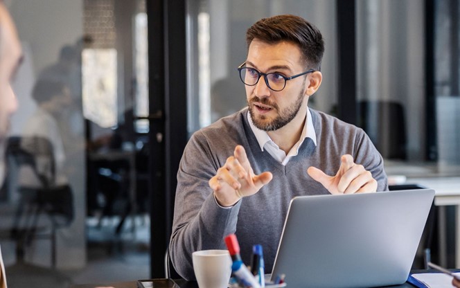 Businessman Discussing Technology Trends With A Group Of People