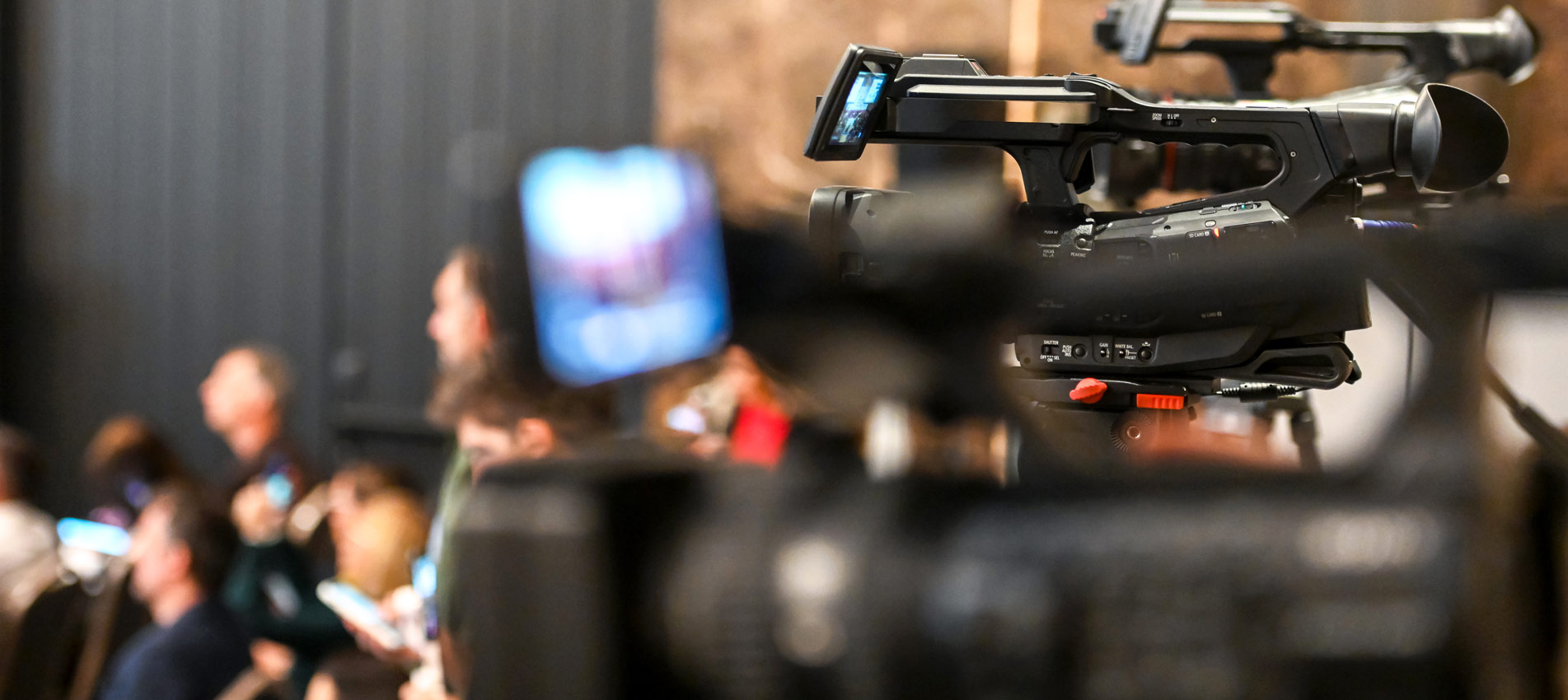 Group Of Journalist And Reporters Filming Media Event With A Television Camera