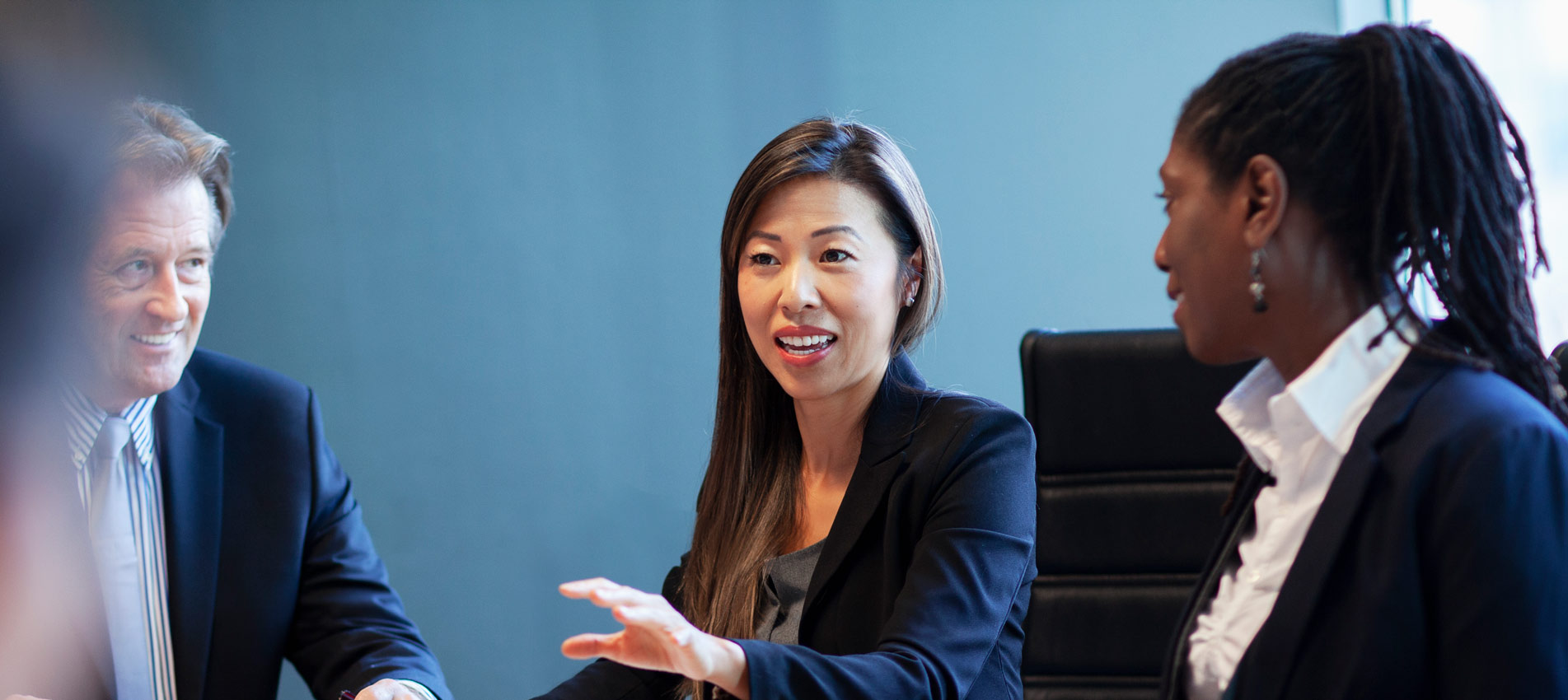 Asian Mid Adult Woman Businesswoman Discussing Ideas During Business Meeting