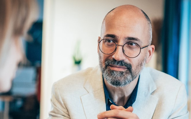 Businessman And Client Having Discussion About Sfa