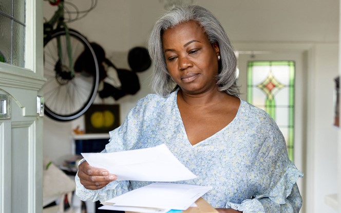 Mature Woman At Home Getting Packages And Letters In The Mail