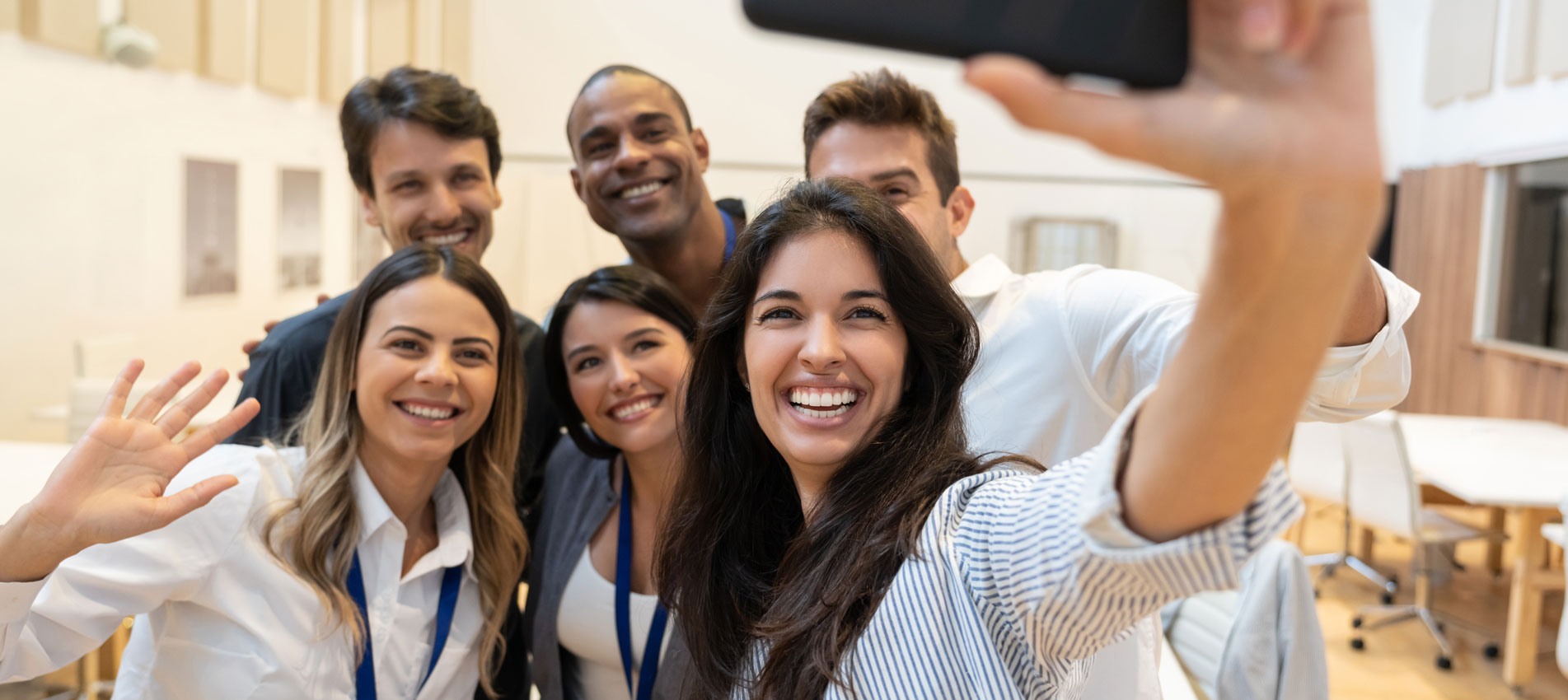 Happy Group Of Coworkers Taking A Selfie At The Office