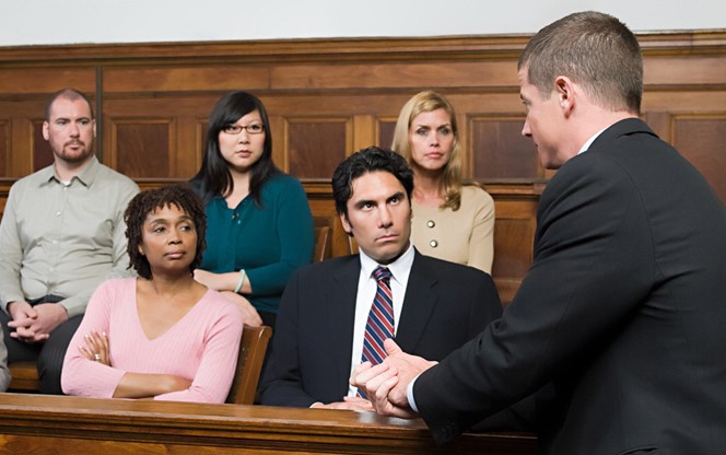A Lawyer And The Jury In A Courtroom