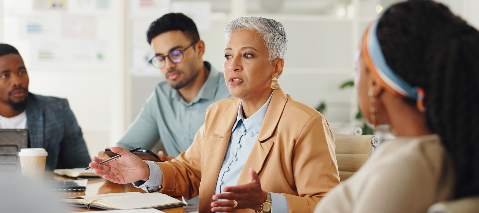 Business People In Meeting Having A Discussion