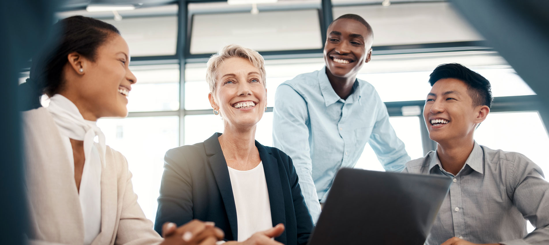 Business Colleagues Smiling At A Meeting