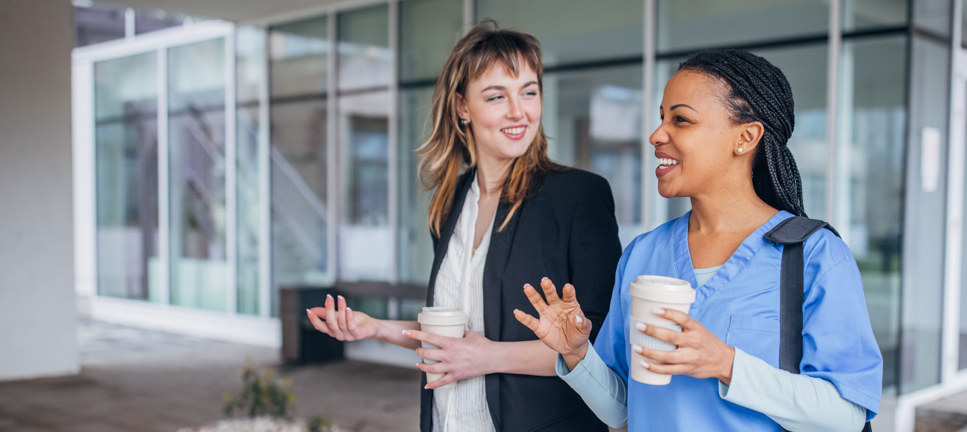 HR Recruiter Welcoming A New Nurse In Front Of The Hospital