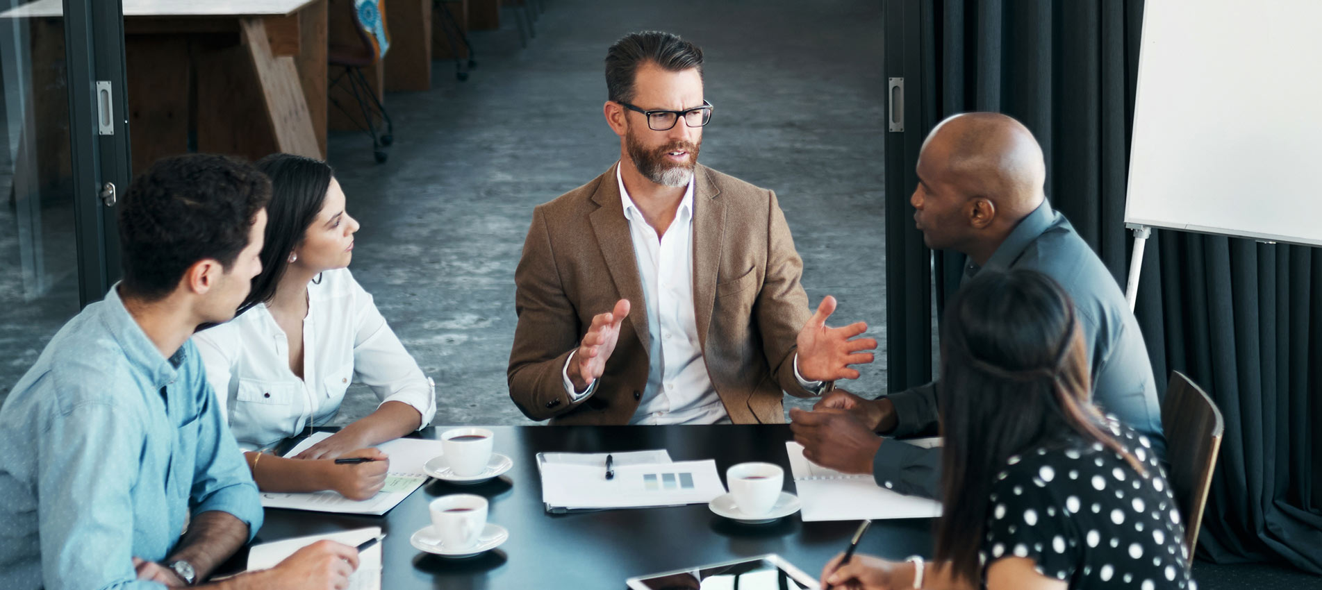 Business People Having A Meeting In Office Boardroom