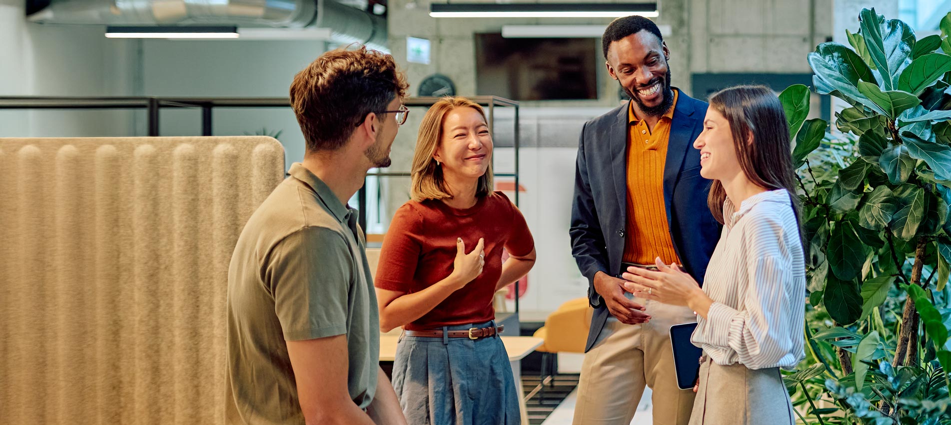 Multicultural Businesspeople Talking And Smiling During A Meeting