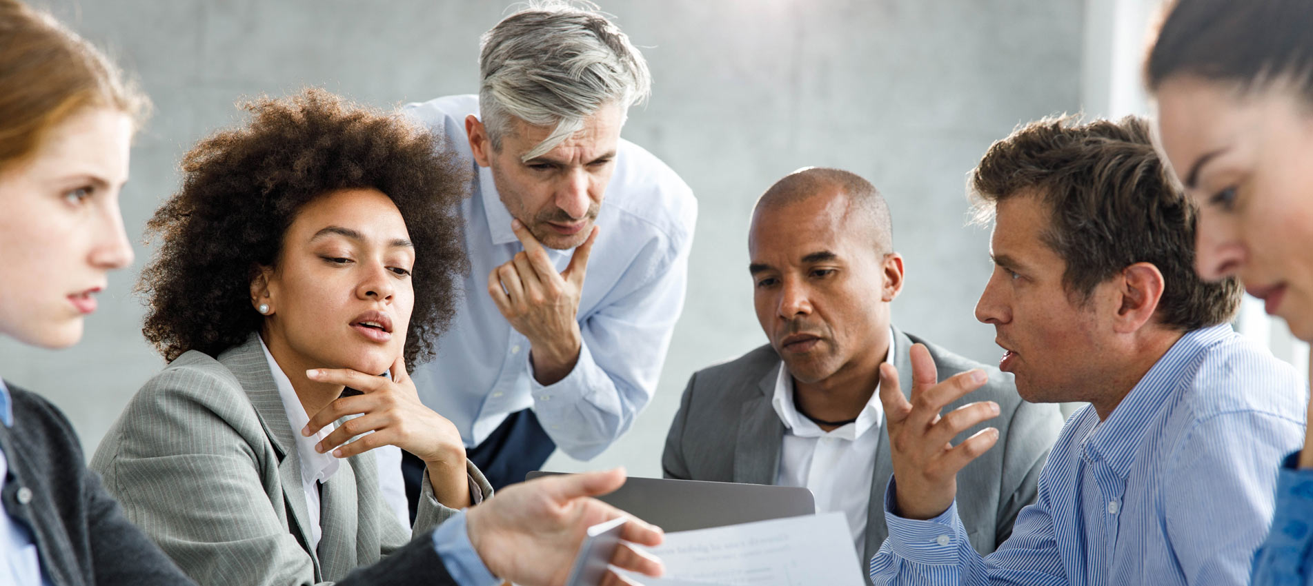 Business Team Analyzing Reports On A Meeting In The Office