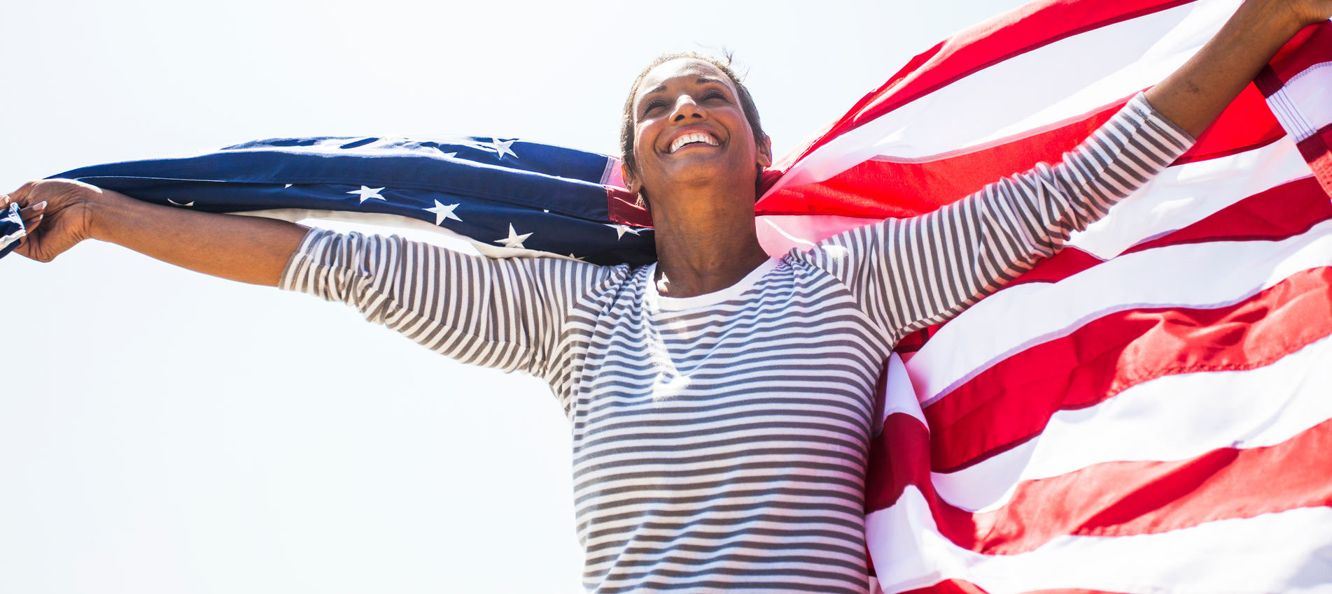 African American Senior Carrying USA Flag
