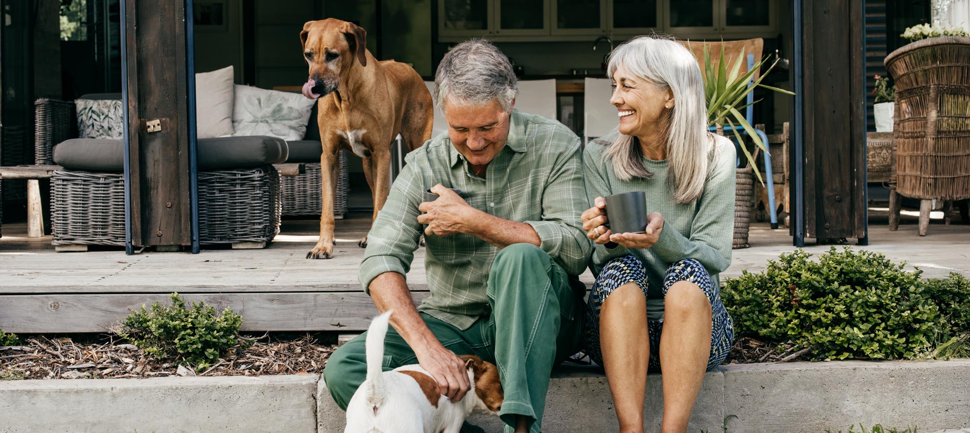 A Loving Couple In Their Golden Years Shares Laughter Over Coffee