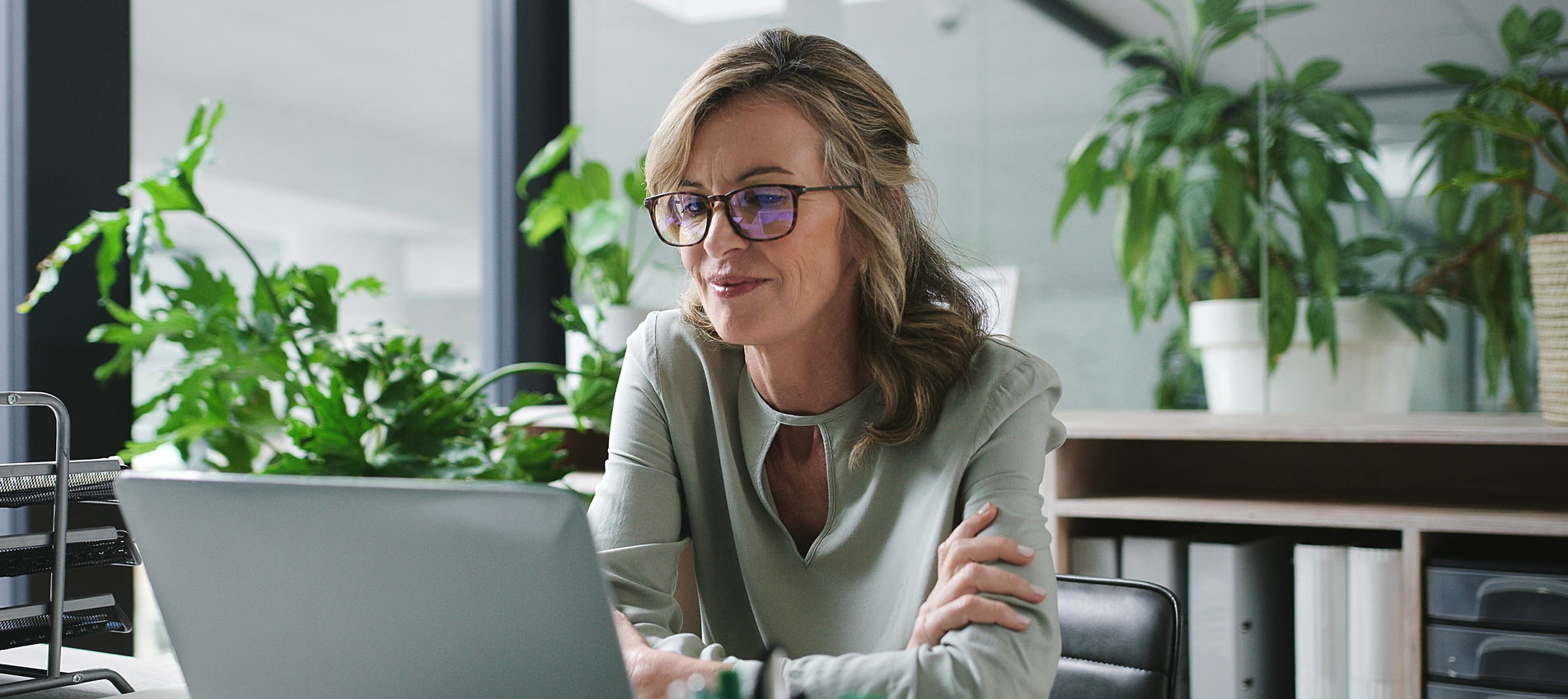 Businesswoman Looking At Laptop In The Office