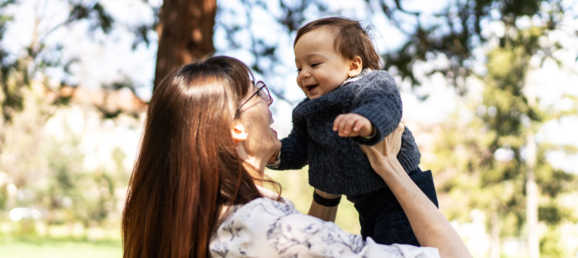 Mother Playing With Her Baby In The Park