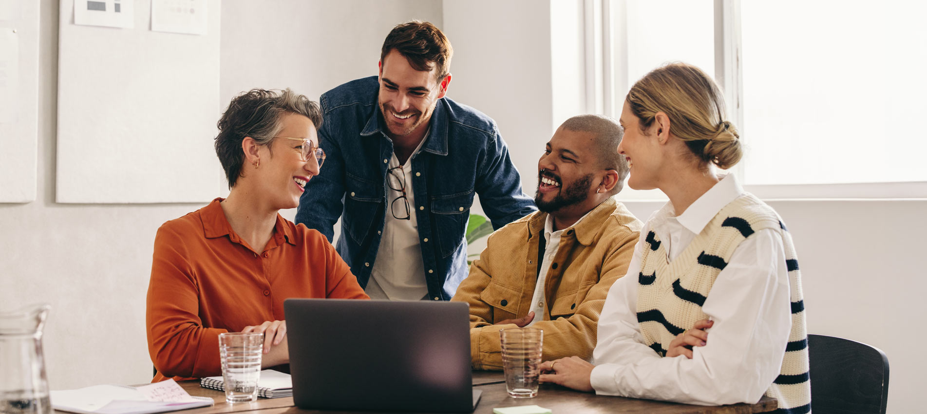 Cheerful Designers Having A Meeting In An Office